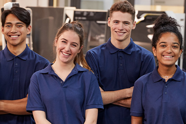 Several team member hands overlaying each other